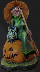 Bruja con lechuza sobre calabaza